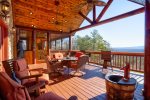 Covered Deck Overlooking Mountains Features Ample Seating and Gas Grill